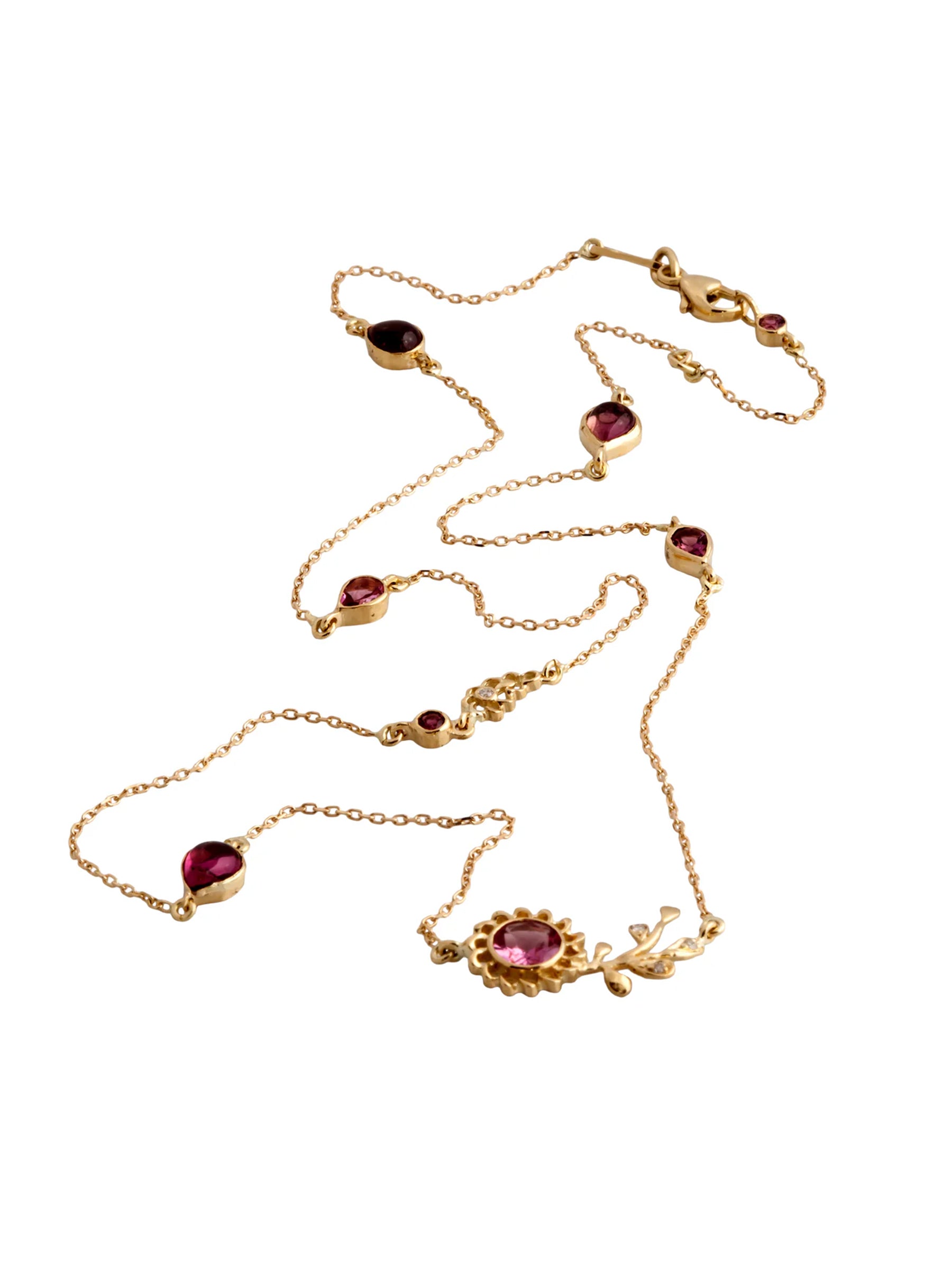 18k gold aghabani lily veins necklace with pink tourmaline and diamonds on a white background