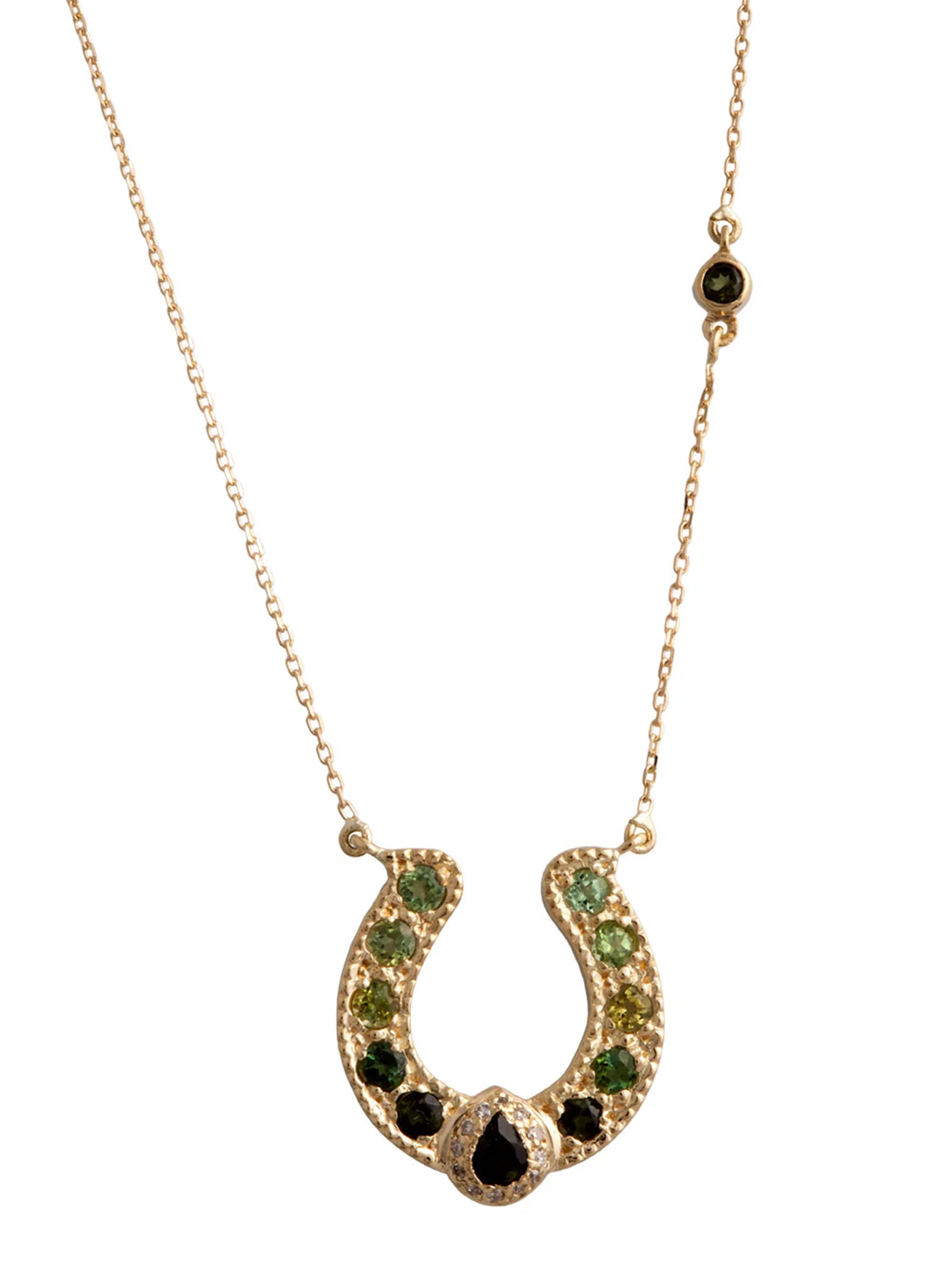 18k gold horseshoe necklace with pear-cut green tourmaline crown on a fine chain, vintage-inspired yet modern.