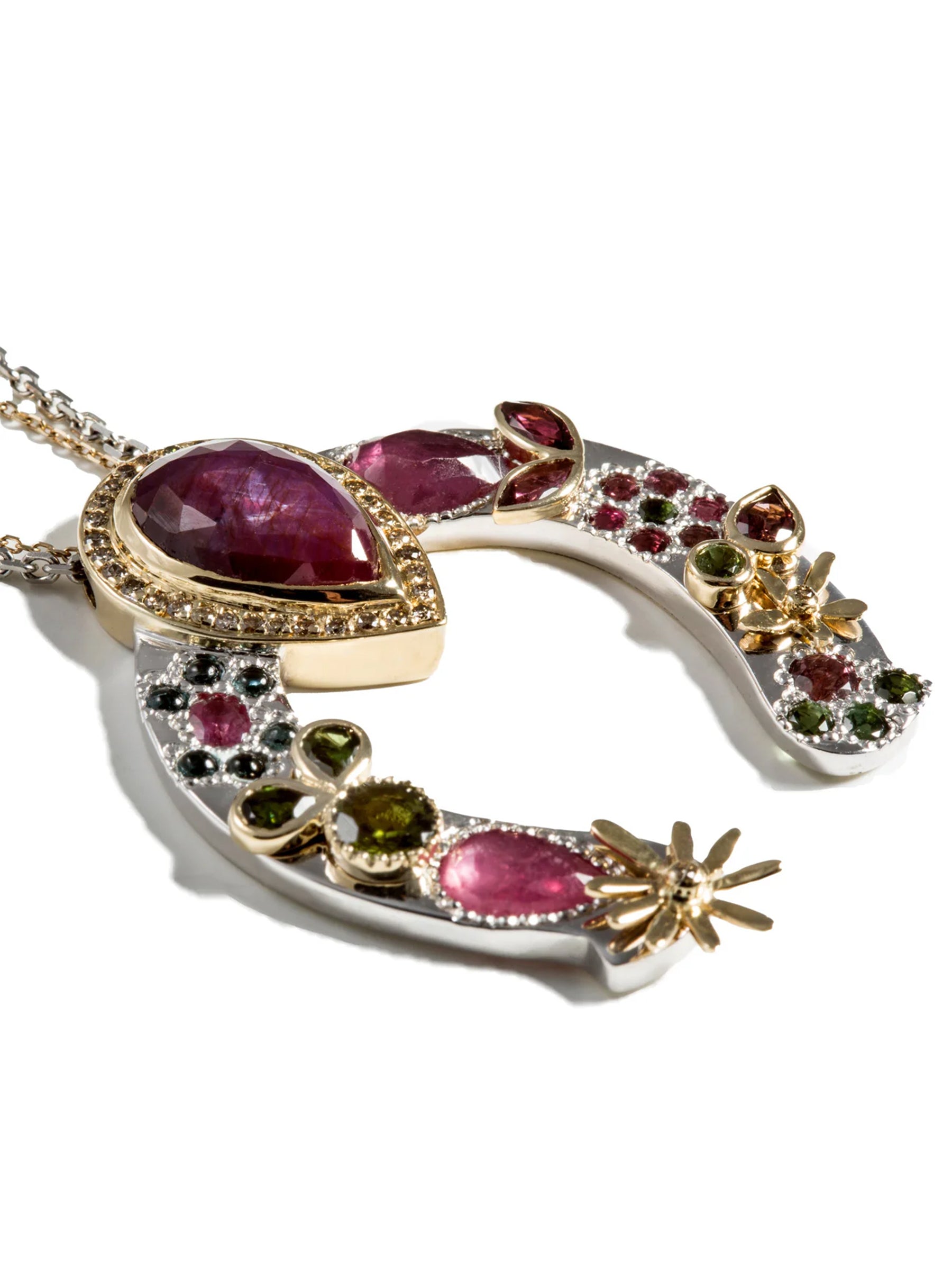 zoom in details for the Horseshoe Red Sapphire Pear Necklace and Diamond Crown.