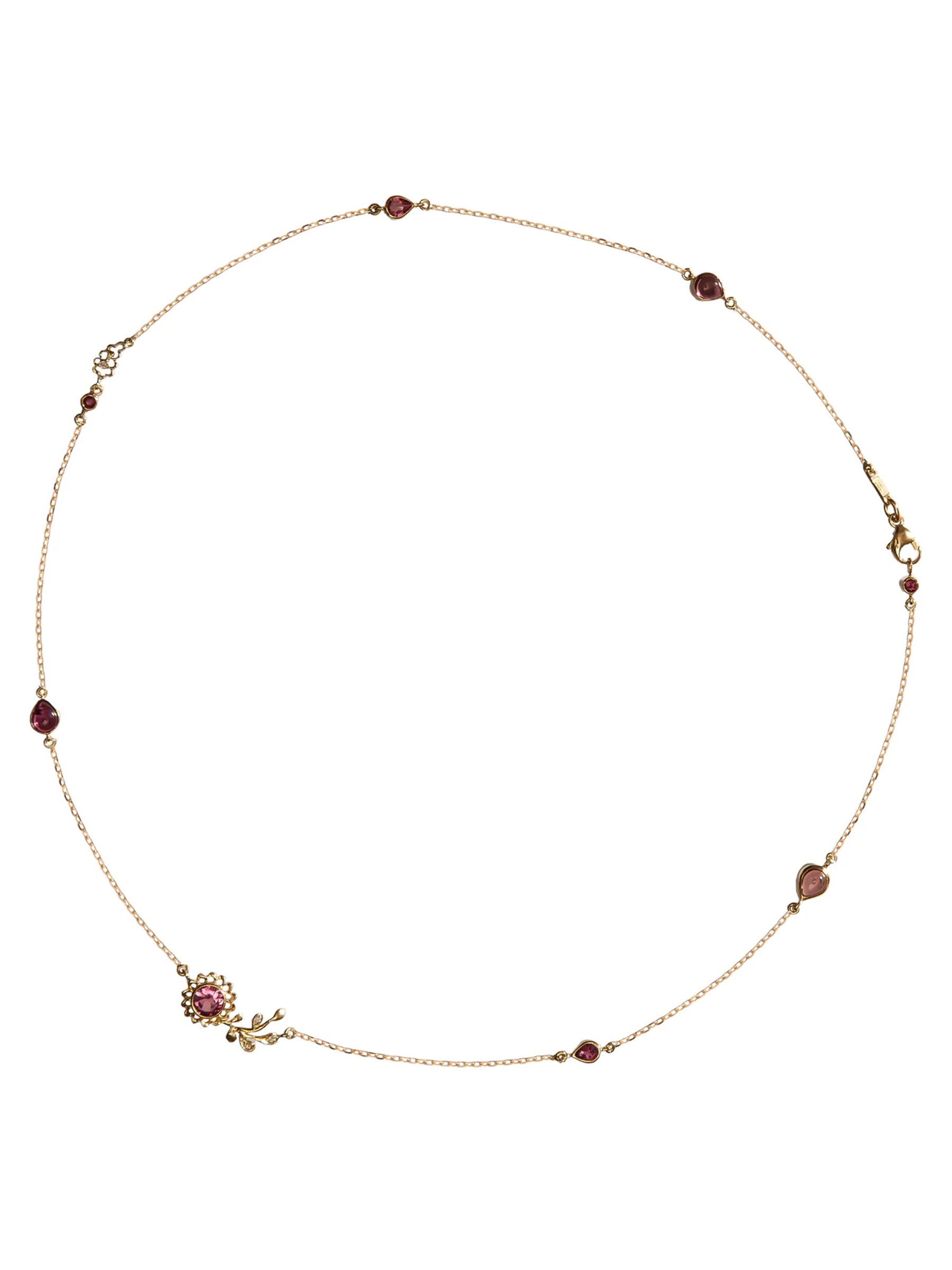 close up 18k gold liliy viens aghabani necklace set in pink tourmaline and diamonds on white back ground