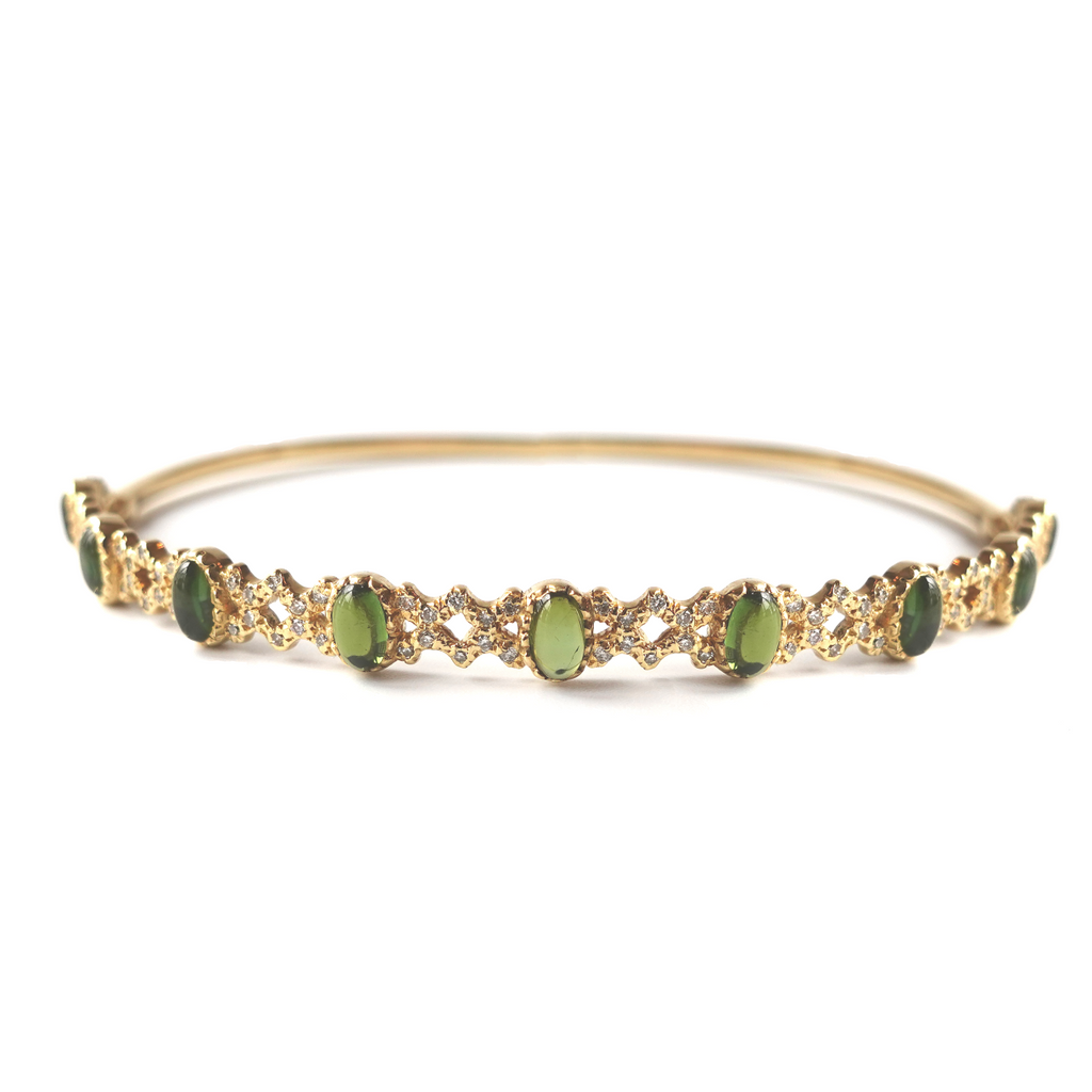 Gold Freestyle Bracelet featuring green cabochon tourmalines and diamond rhombus accents on a white background