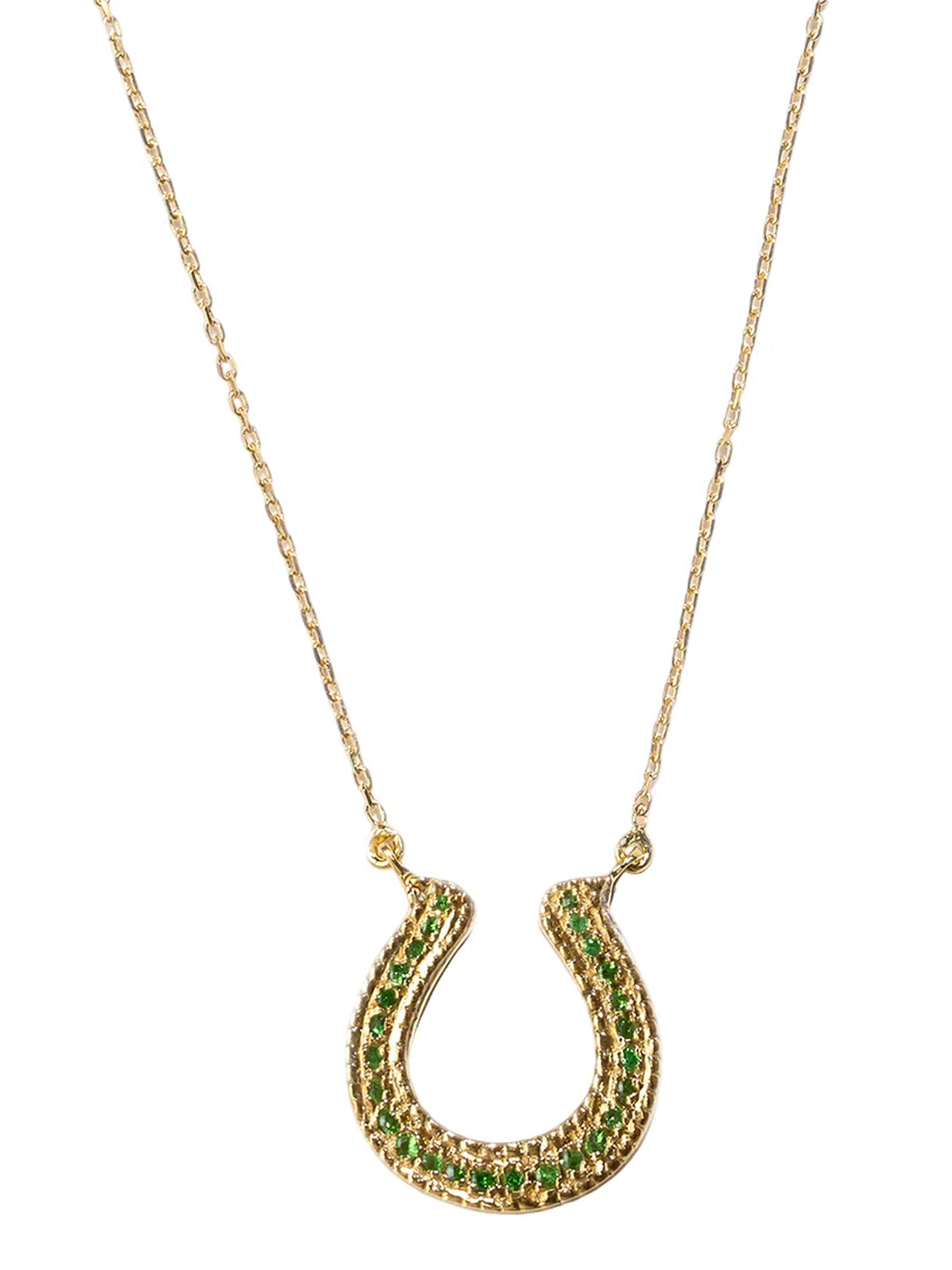 Handcrafted 18k gold horseshoe necklace with green tsavorite on a fine chain.