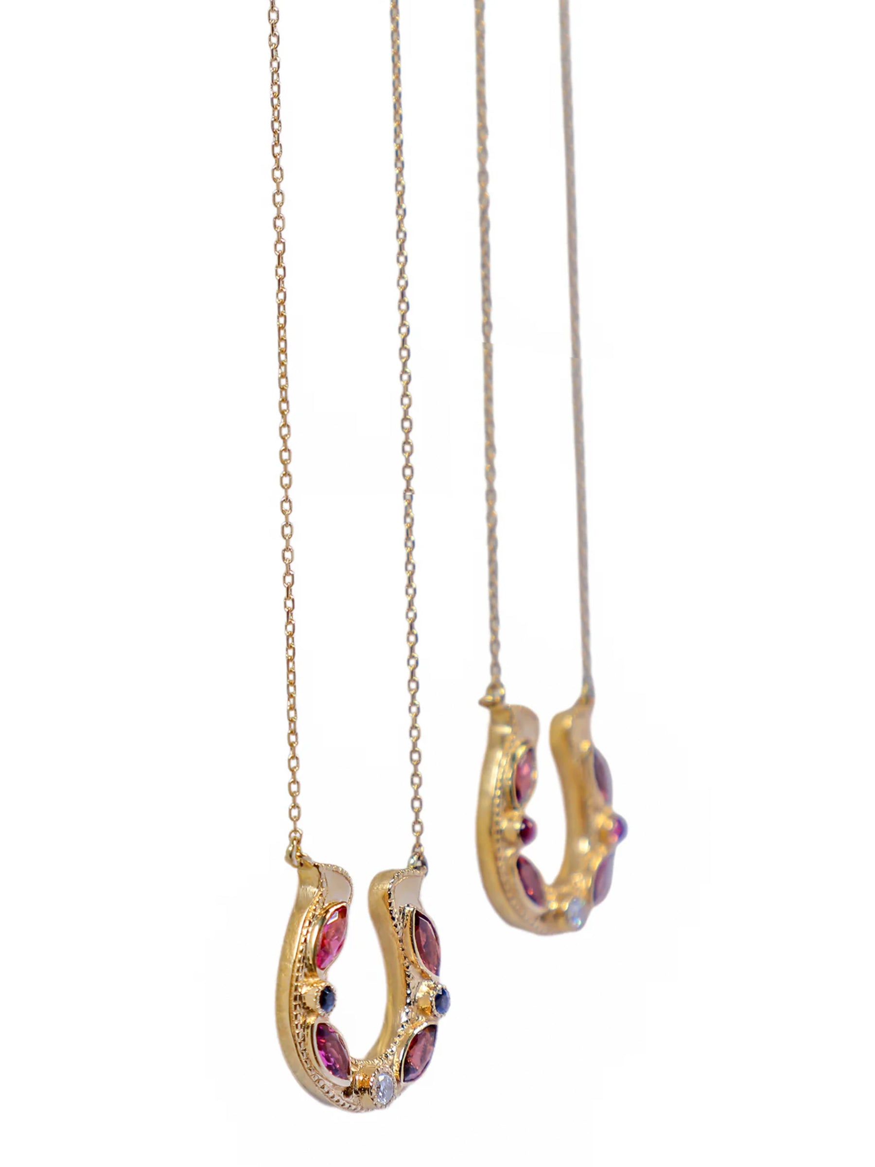 Two Horseshoe Pink Tourmaline Marquise Necklaces in 18k Gold and diamonds.